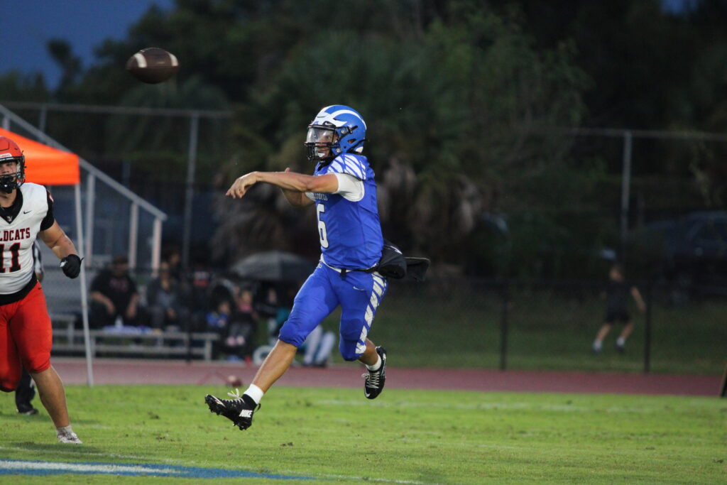Kai Goodling makes a running throw complete to Ceon Cotton.