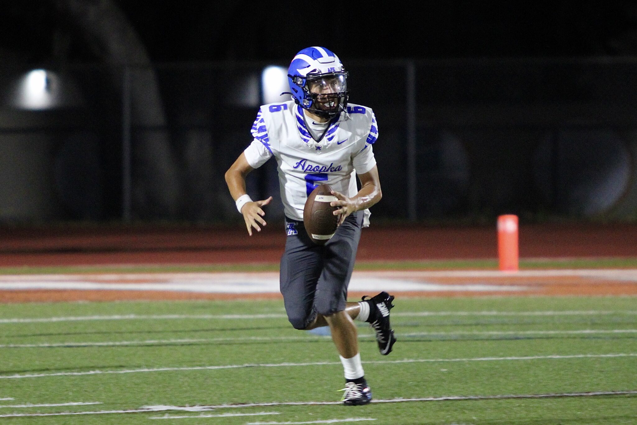 Kai Goodling reads the field as he rolls to his right.