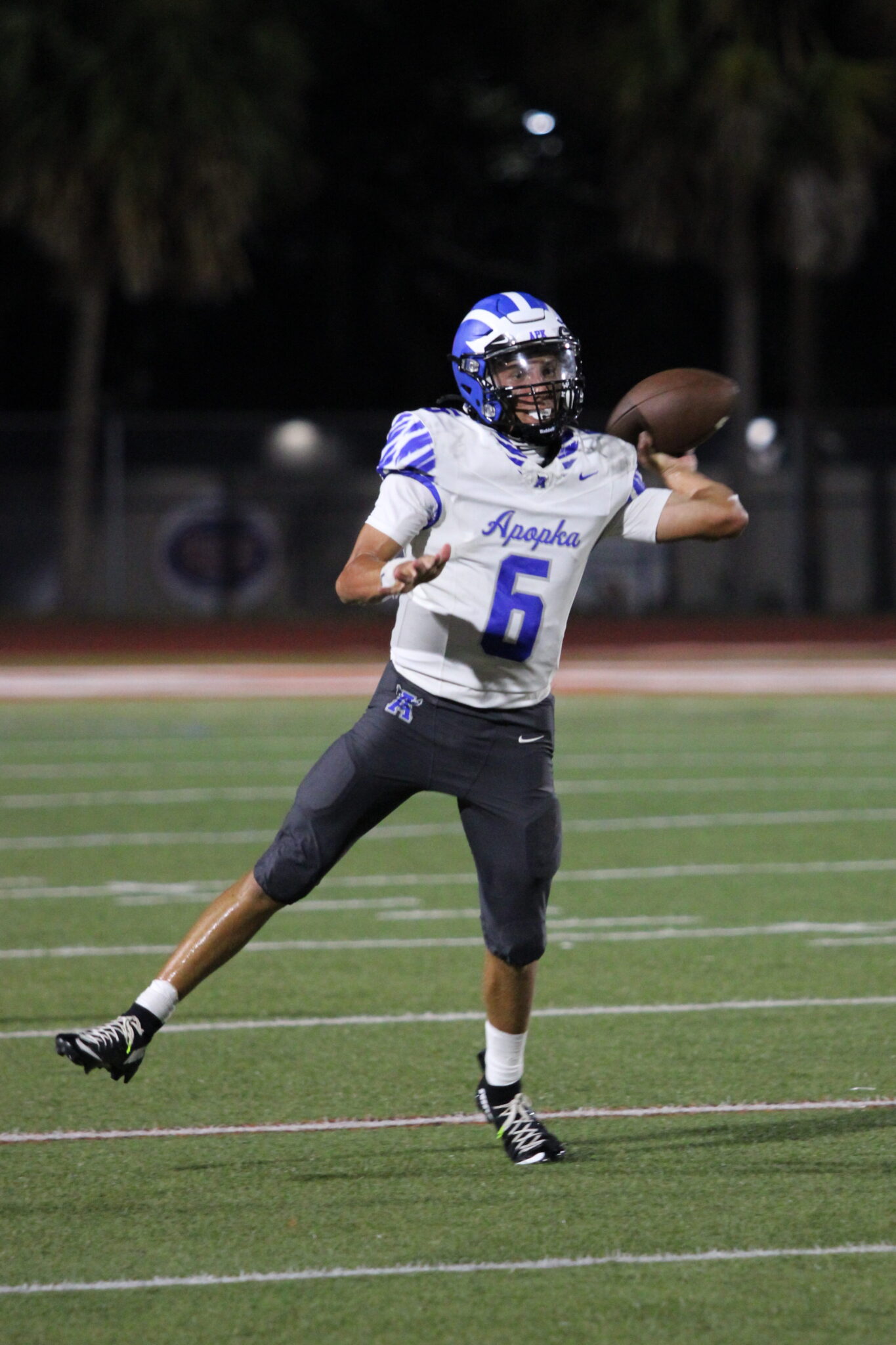Kai Goodling rolls right and throws off his opposite foot.