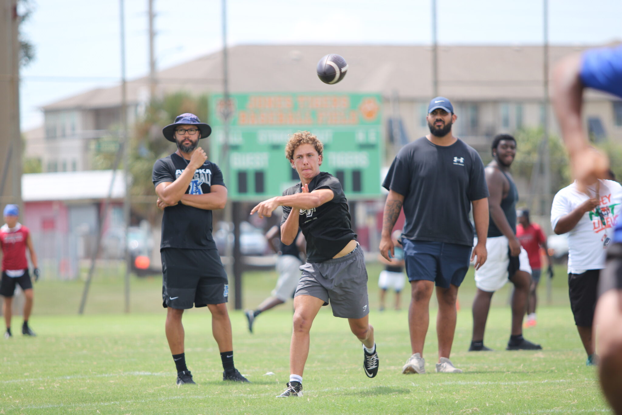 Kai Goodling throws a bullet pass to Xavier Cruz at the front pylon of the end zone.