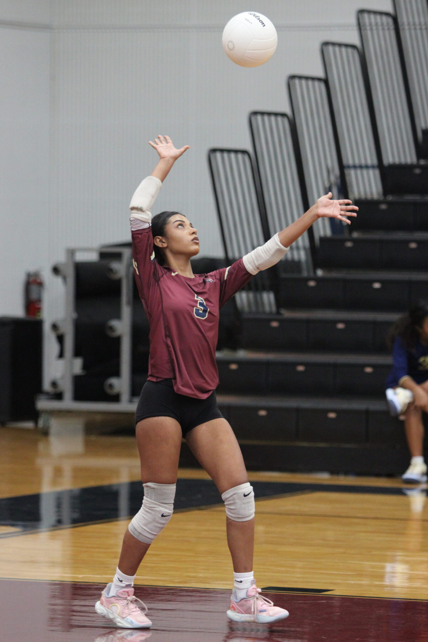 Mikayla Rivera steps up to serve.