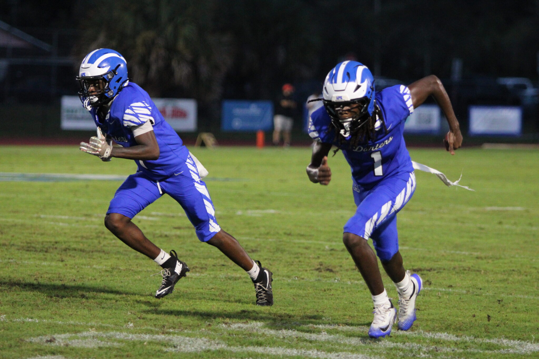 Nyzier Collington and Johnson Navilssaint launch off the line of scrimmage in twins formation.