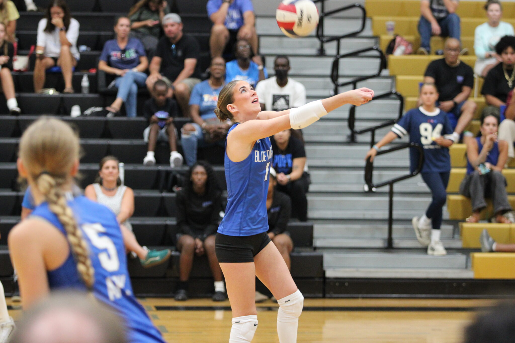 Taylor Cain bumps a ball toward the net in the third set.