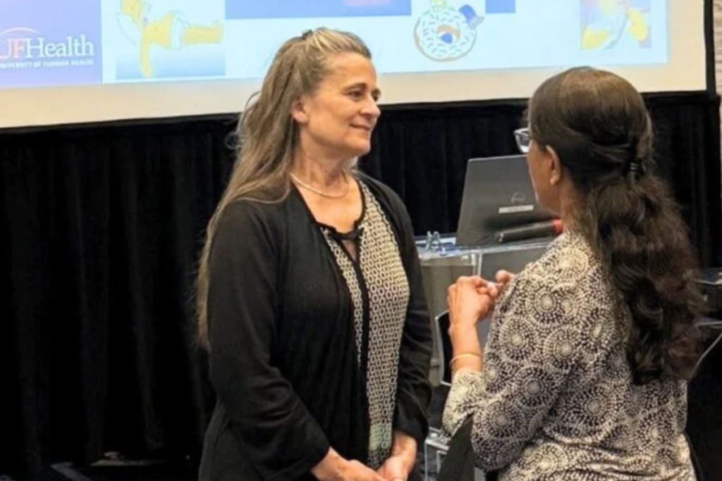 Nurse practitioner Windy Purtlebaugh speaks with an attendee at a recent talk she delivered on strokes and heat stroke.