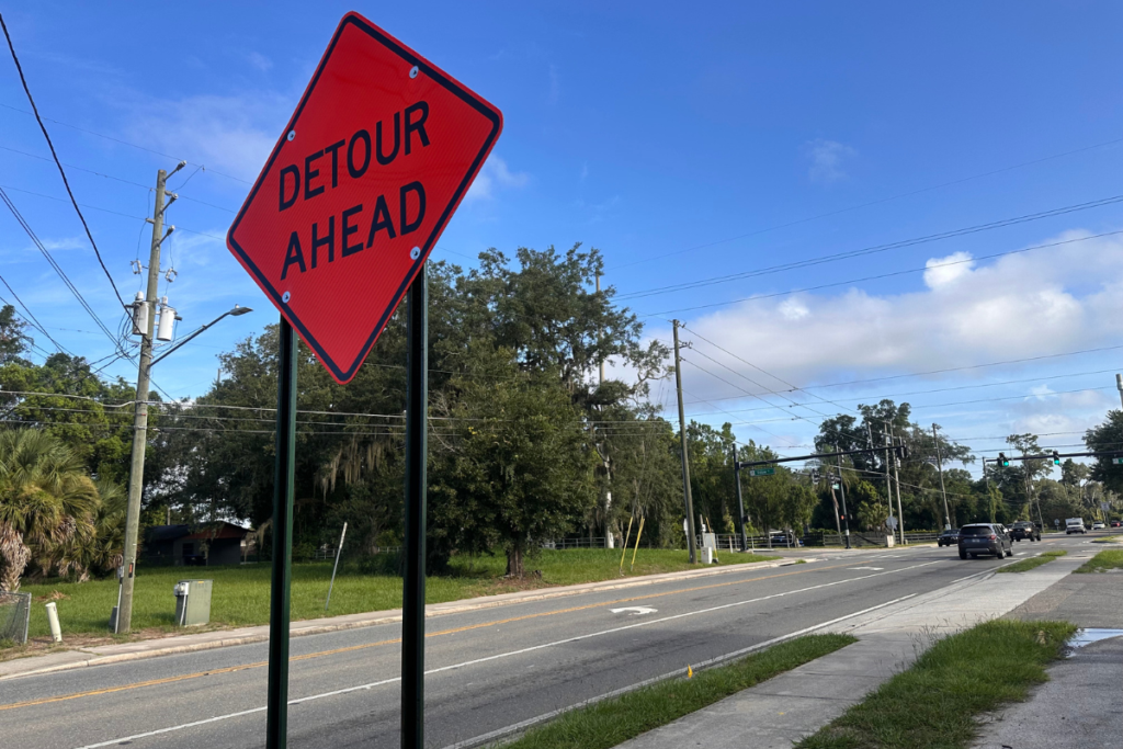 A “Detour Ahead” sign alerts motorists near Votaw Road to a closure of a portion of North Thompson Road. The road is expected to remain closed for about 30 days while Orange County Utilities performs septic-to-sewer construction in the Wekiwa Springs area. 
