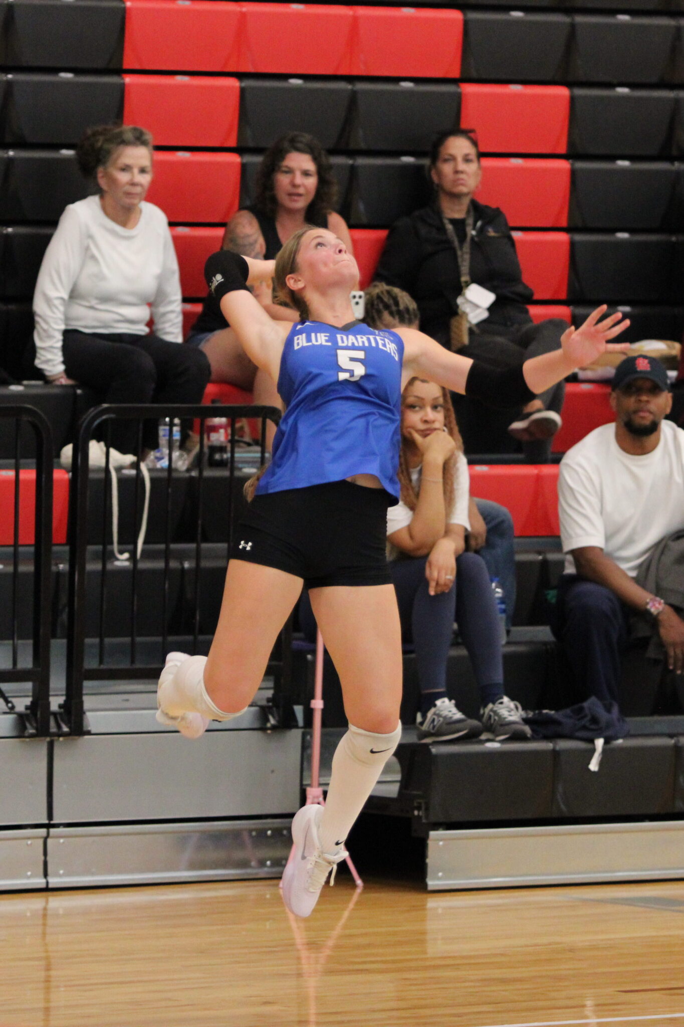 Victoria Polusmak winds up to send a serve to Lake Buena Vista.