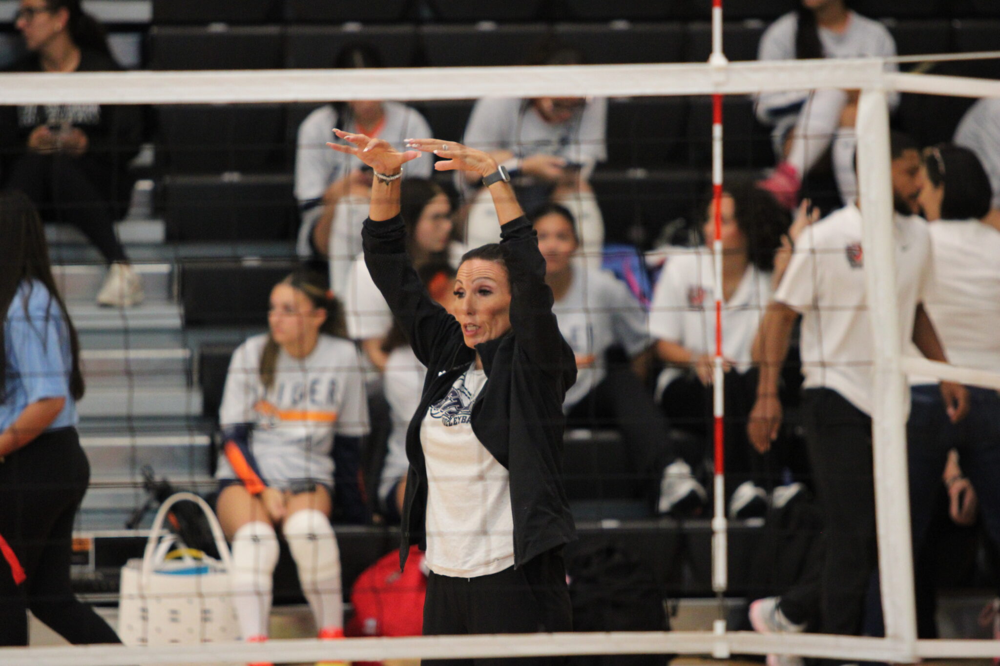 Wekiva coach Heather Lorenz telling and showing her players to dump the ball.