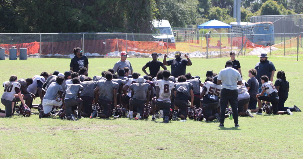 Wekiva Mustangs team huddle at practice ahead of the kickoff classic.