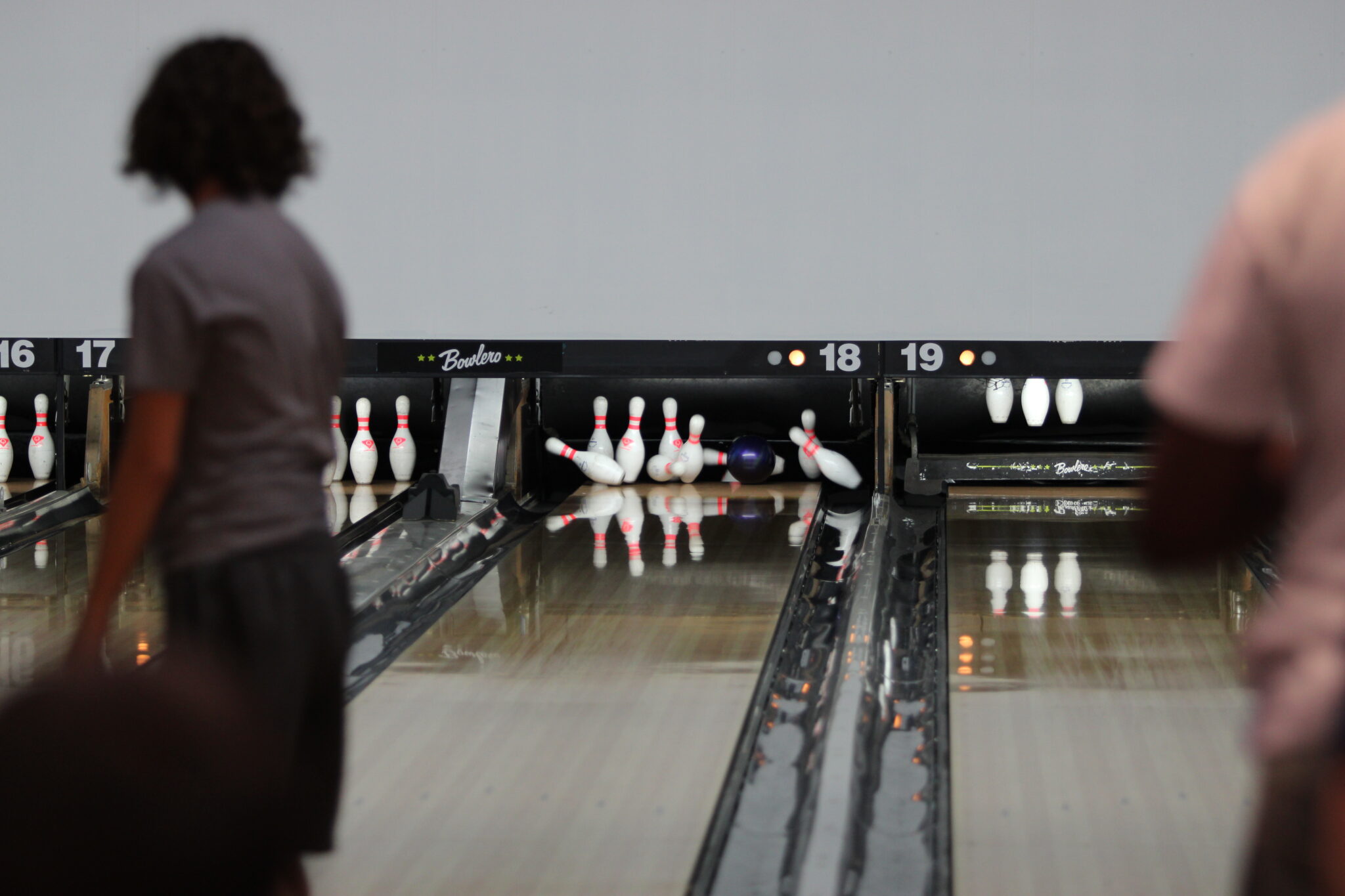 An Apopka bowler watches his ball crash through a set of pins at practice.