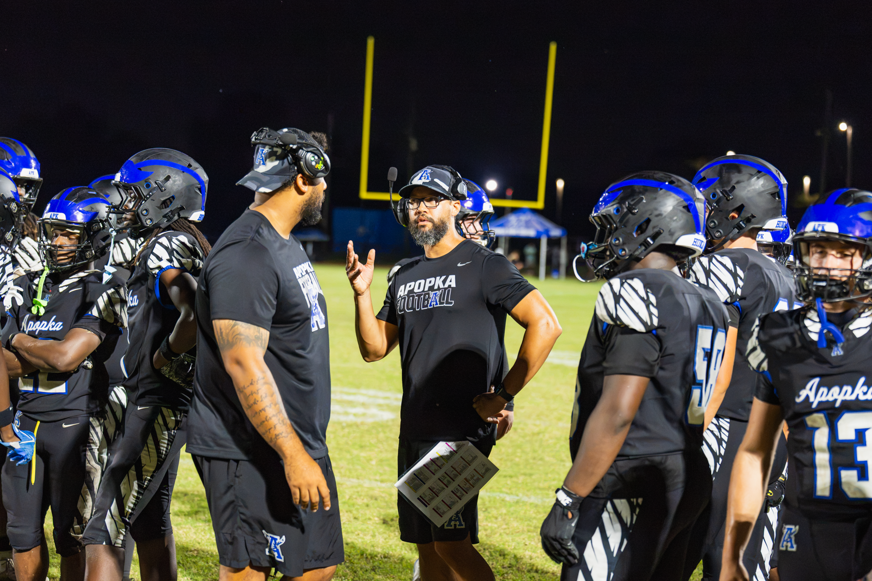 Coach Marcus Neeson talks to offensive line coach Janko Beras during a timeout.