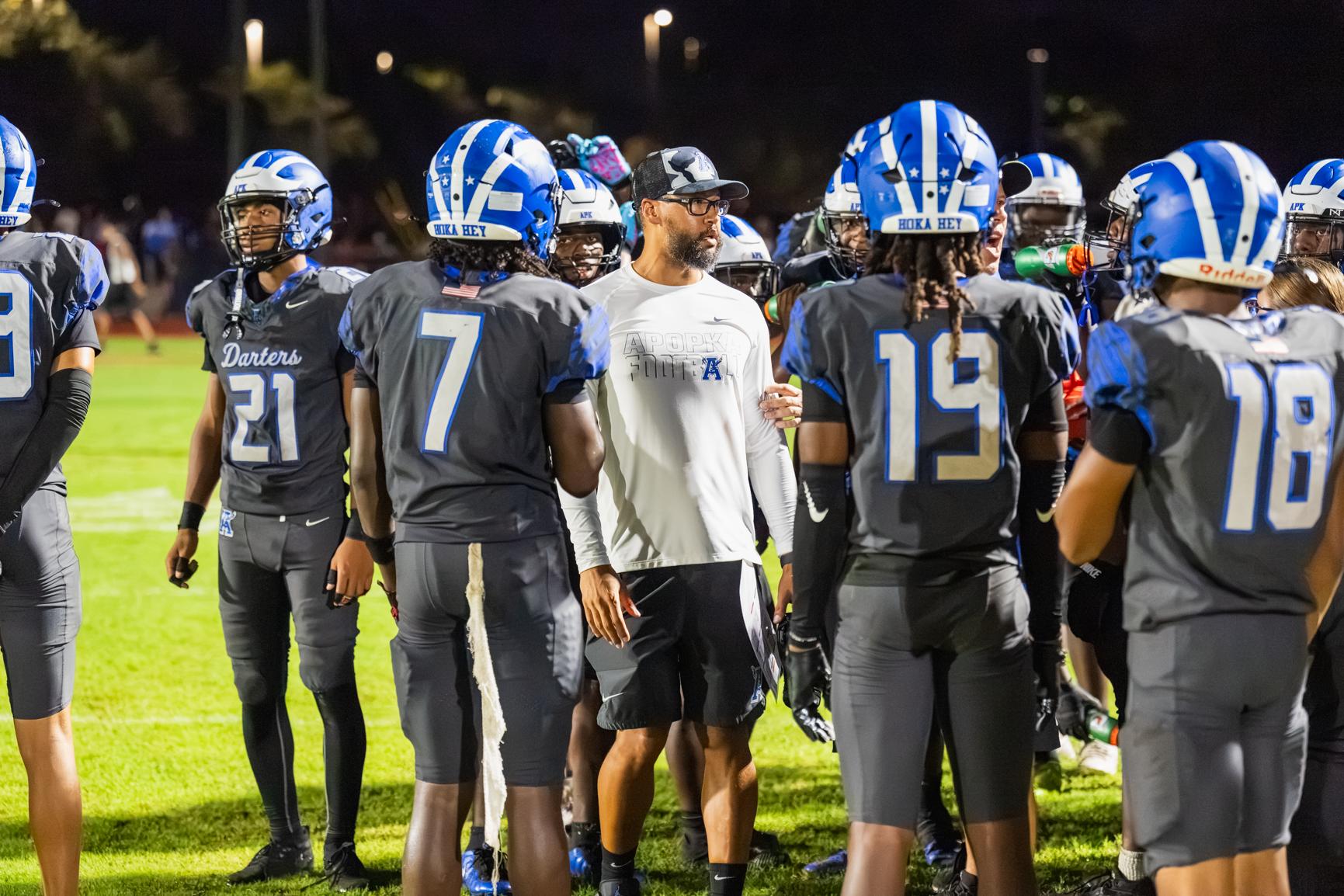 Coach Marcus Neeson talks to some players on the sideline late in the game against Ocoee.