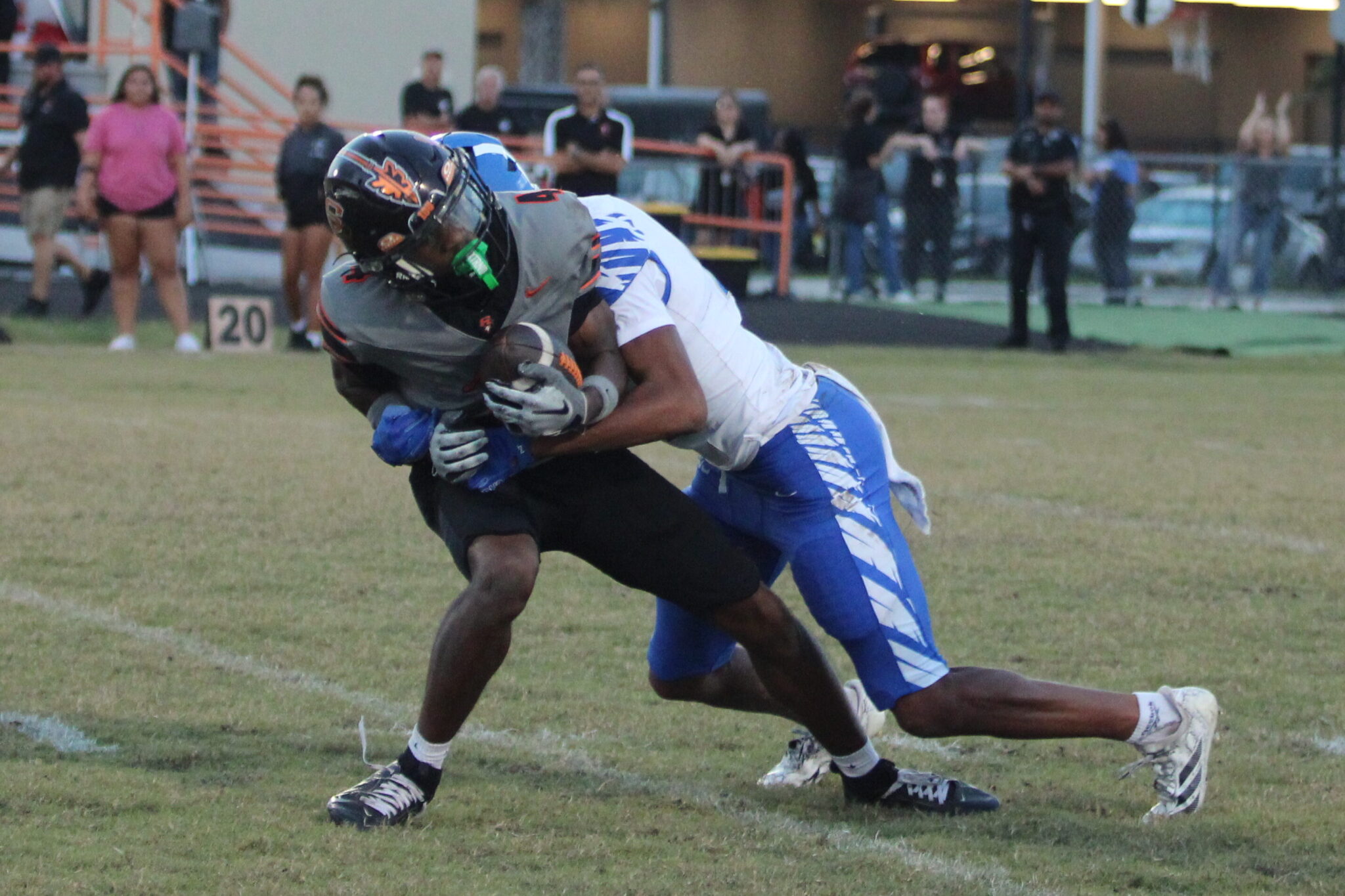 David Wemberly clobbers a the receiver as he catches the ball.