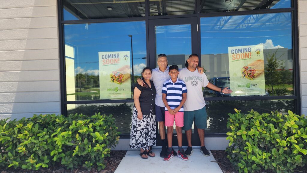 From left to right: Anjalee Patel, Bhaskar Patel, Aaryan Patel and Viraag Patel pose outside of the upcoming Burrito Guyz in Apopka.