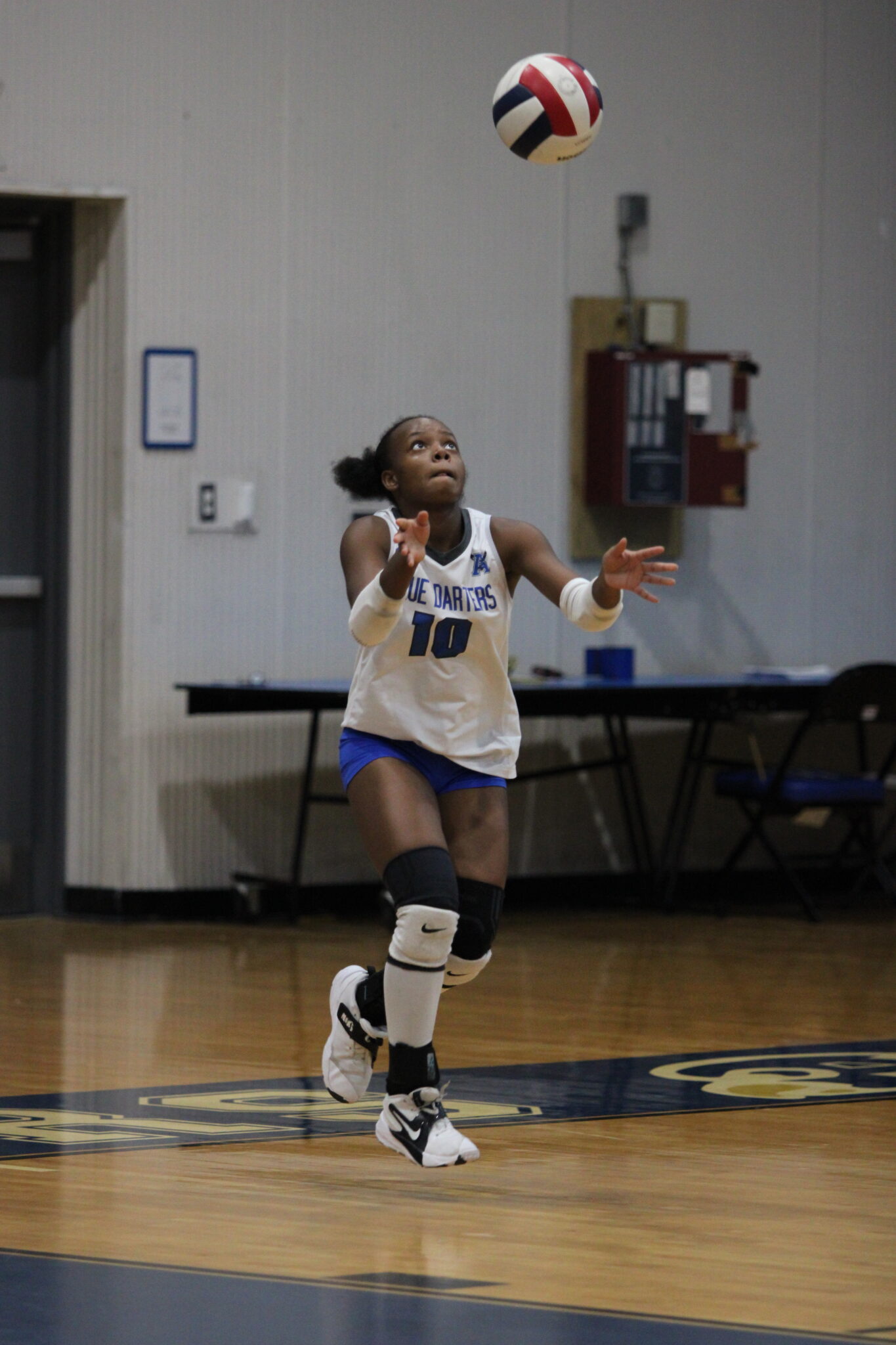 Marie Hughes tosses up her serve to Evans, finishes the game with 9 aces.