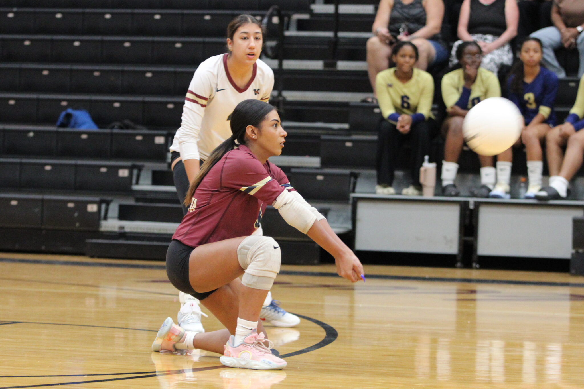 Mikayla Rivera receives a low serve.