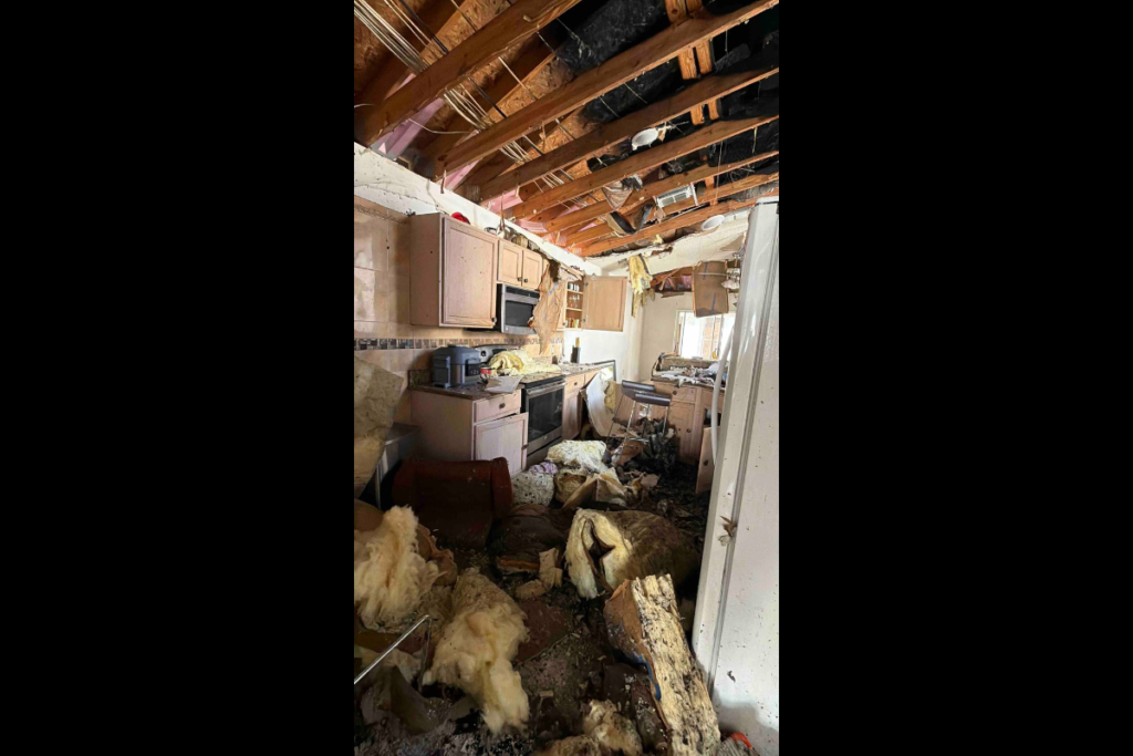 Damage from a Sept. 9 lightning-caused fire left the ceiling open and scattered insulation and debris throughout the kitchen of an Apopka family’s home. The residence was deemed uninhabitable.