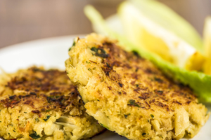 Maryland crab cakes, jalapeño cheese grits and upside-down cake