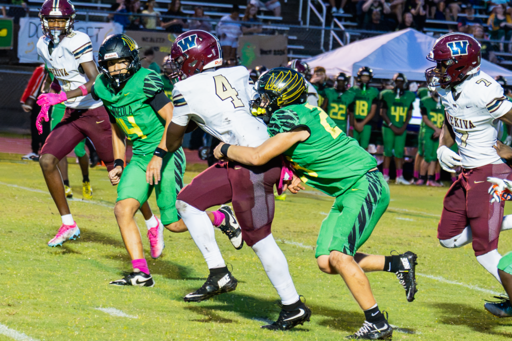 Landon Jerome drags a defender on a 10-yard run.