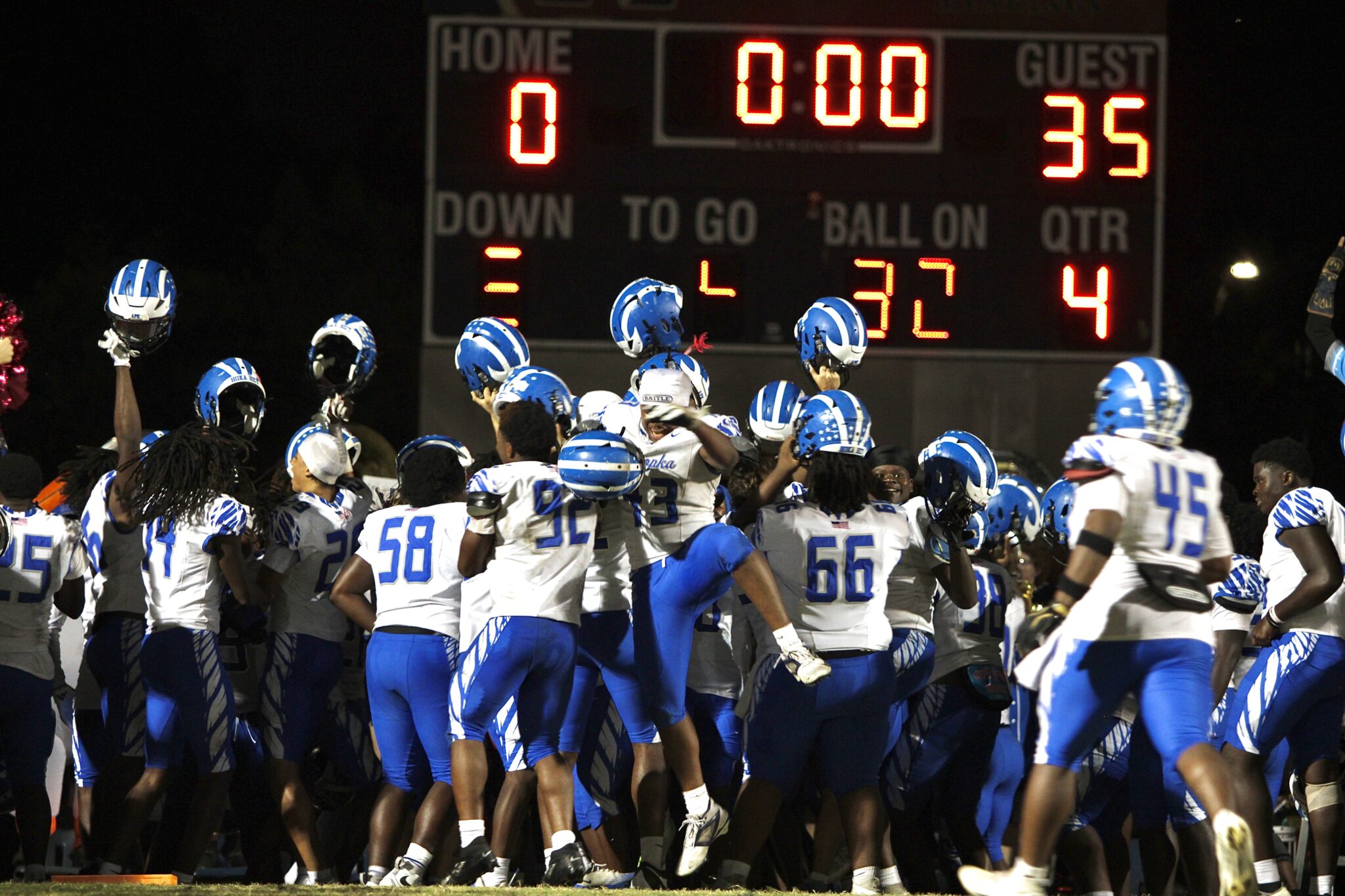 Apopka celebrates their win with the band in the end zone.