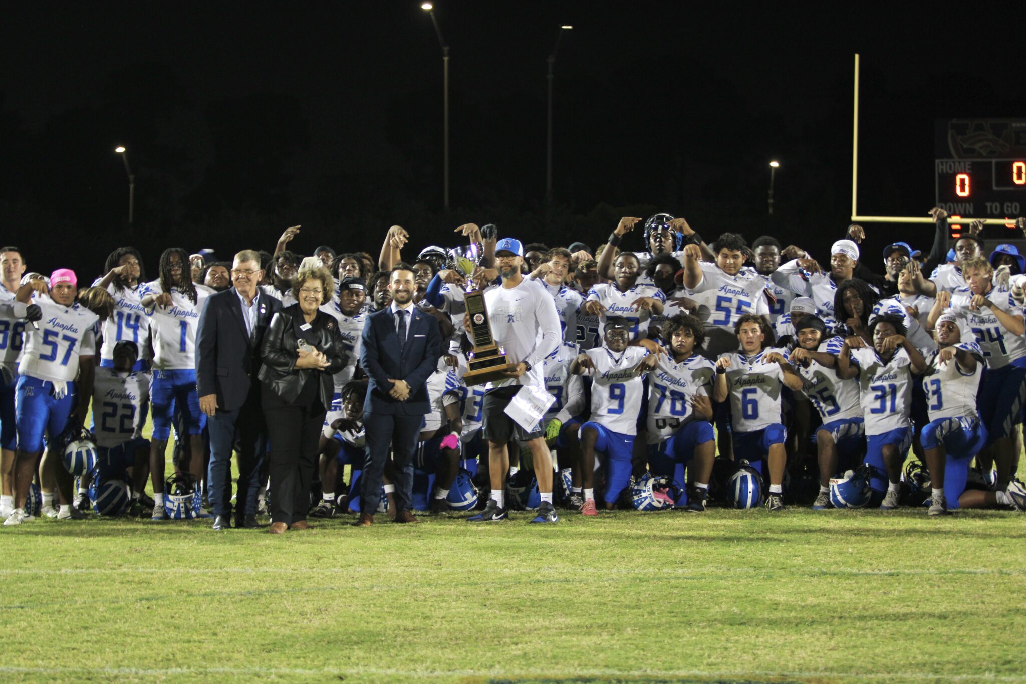 Apopka gathers and poses with the Mayor's Cup.