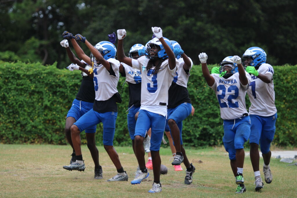 Apopka offense has a party in the end zone after Jakyvion Kemps wheel route catch in practice.