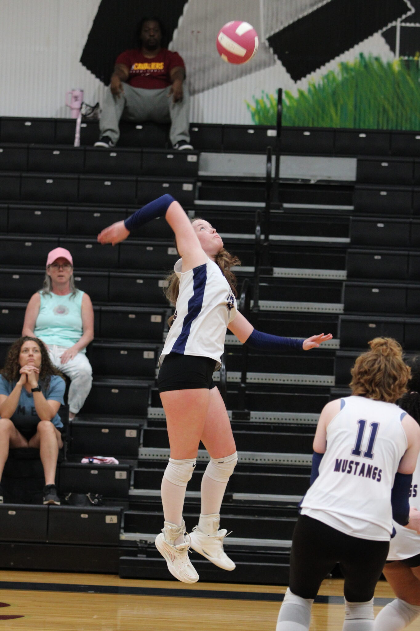 Avianna Mater leaps to spike a ball set by Isabella Espada.