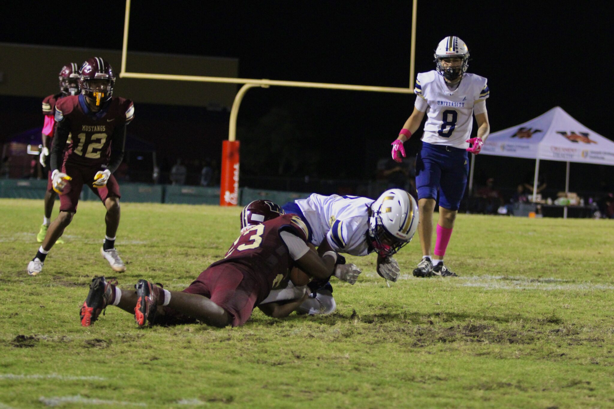 De'Andre Payne dives to take away the ball from a University Cougar for an interception.