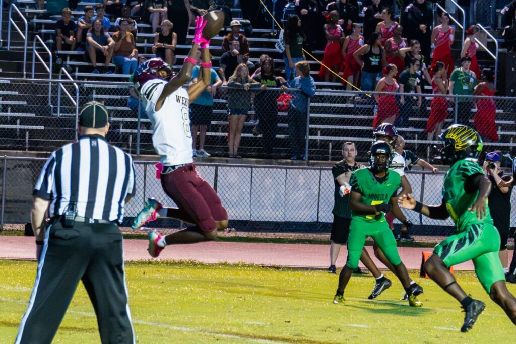 Deandre Adams hauls in a touchdown pass to give Wekiva the early lead.