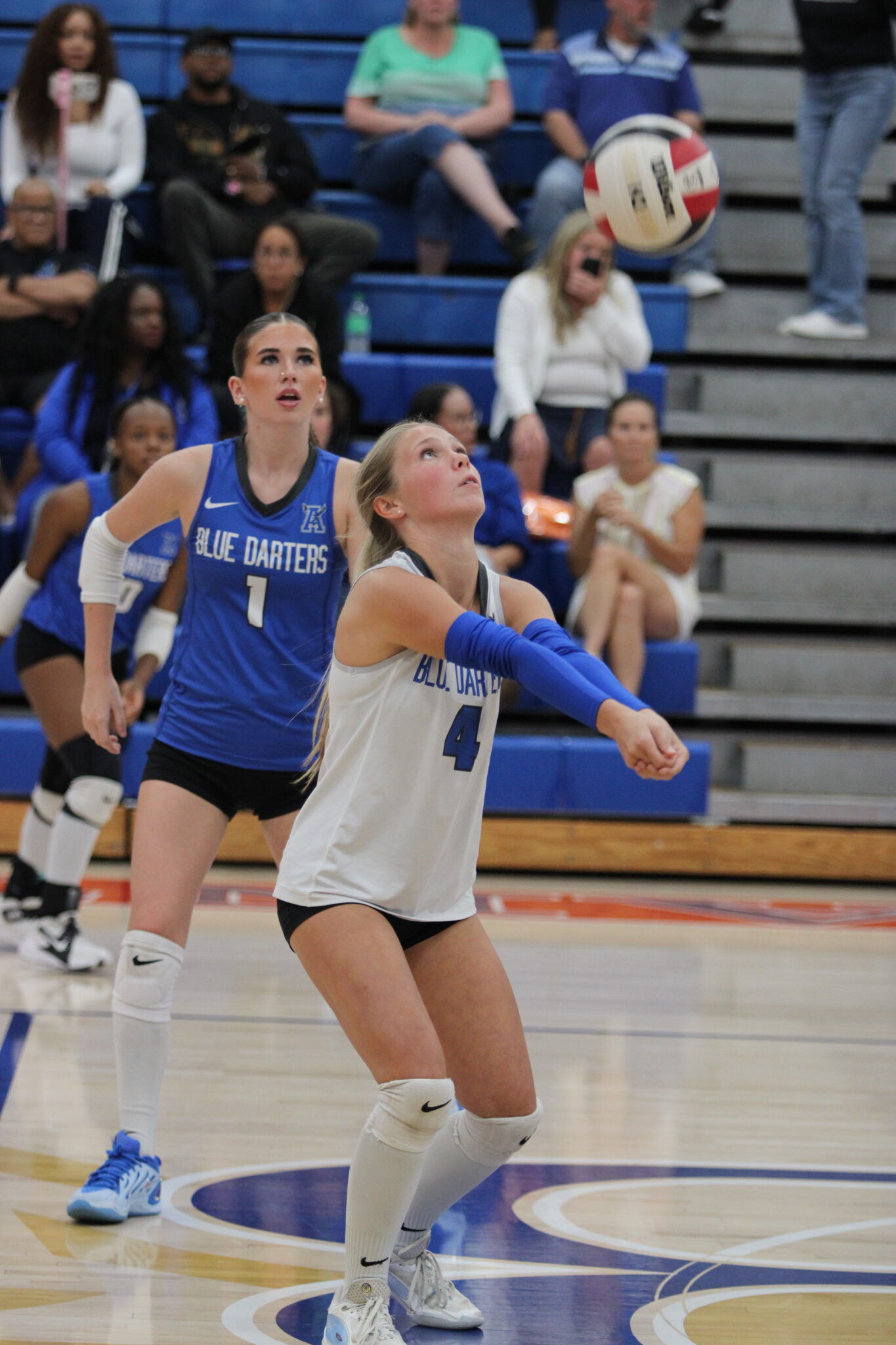 Emma Vincent positions herself to bump a ball for setter Taylor Cain.