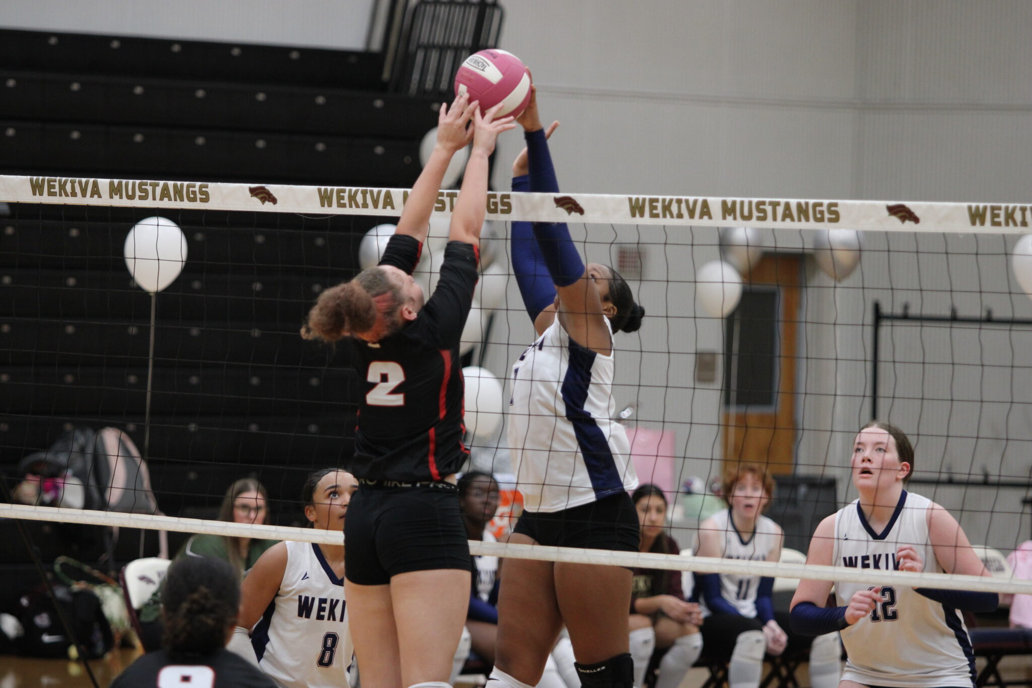 Ginia Reese in a net battle with an Edgewater Eagle.
