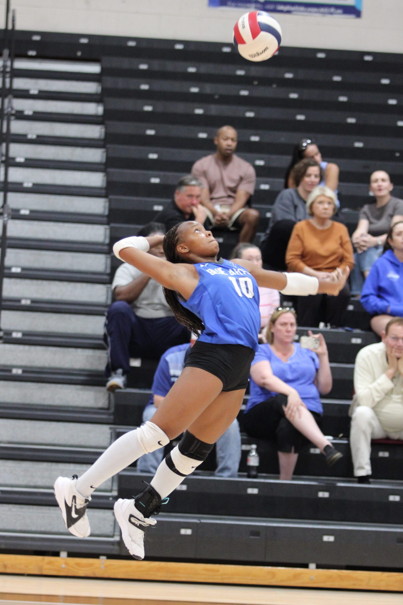 Marie Hughes blasts a serve across the court to Seminole.