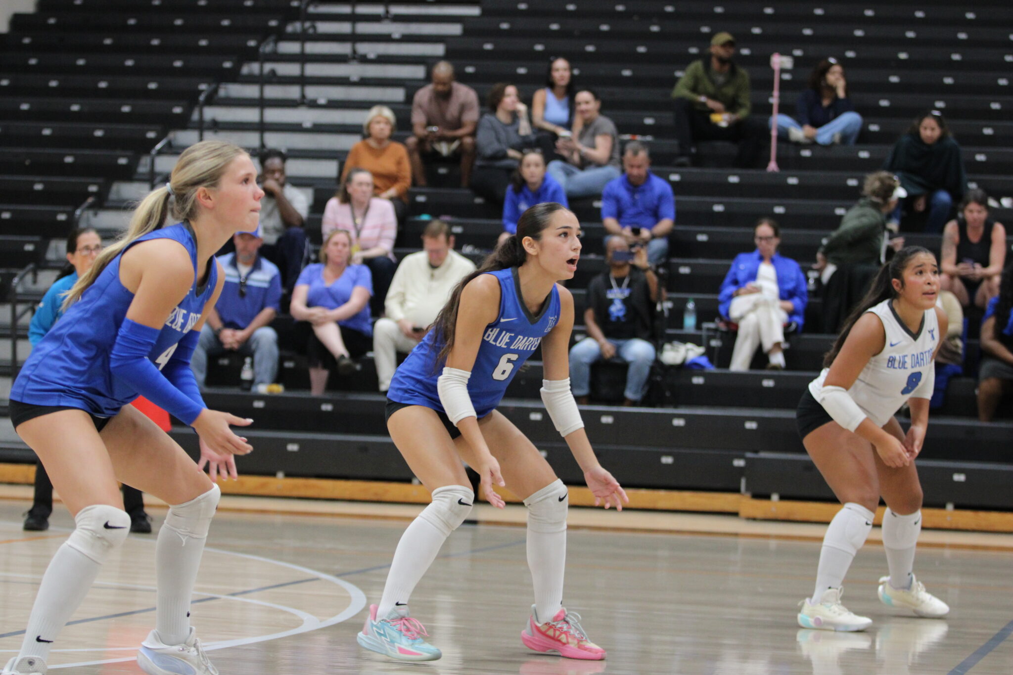 Isabel Romero communicates with the back row on the serve receive.