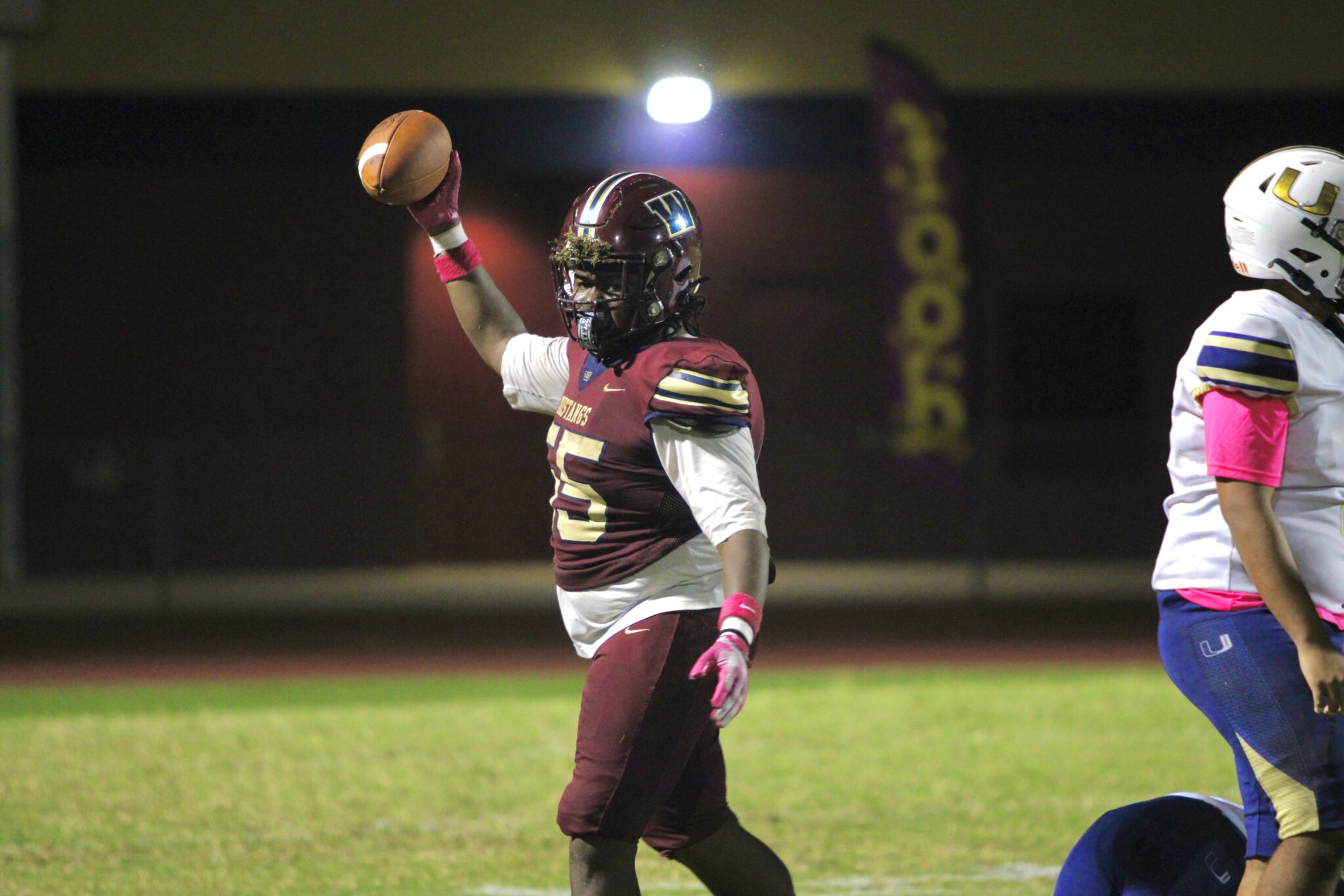 Izayah Bell recovers a fumble on University's interception return.