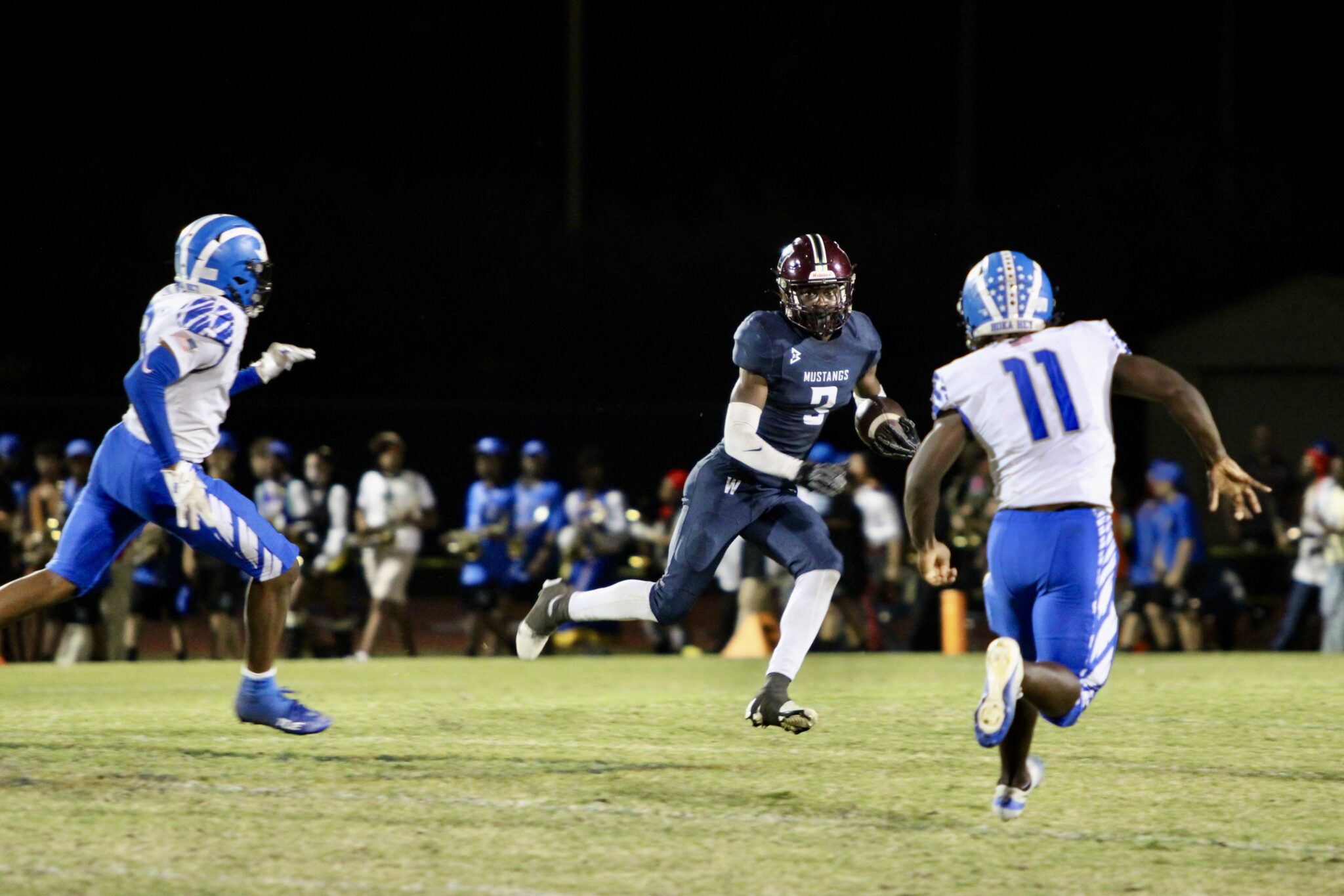Jakendall Kemp and Joshua Taylor crash down on Avantae Scott during a punt return.