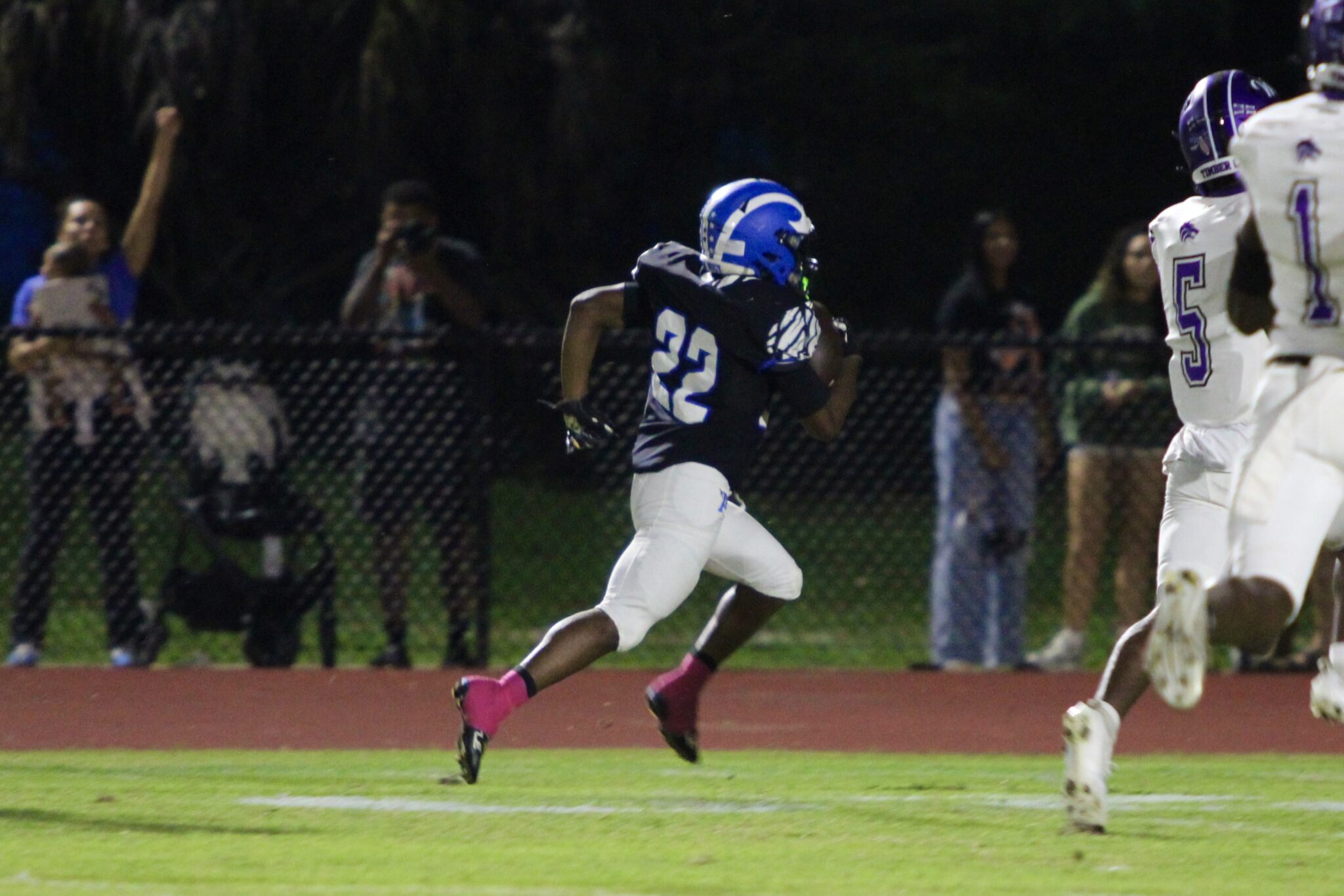 Jakyvion Kemp races the length of the field after catching a double pass trick play from Nyzier Collington on the first offensive play of the game.
