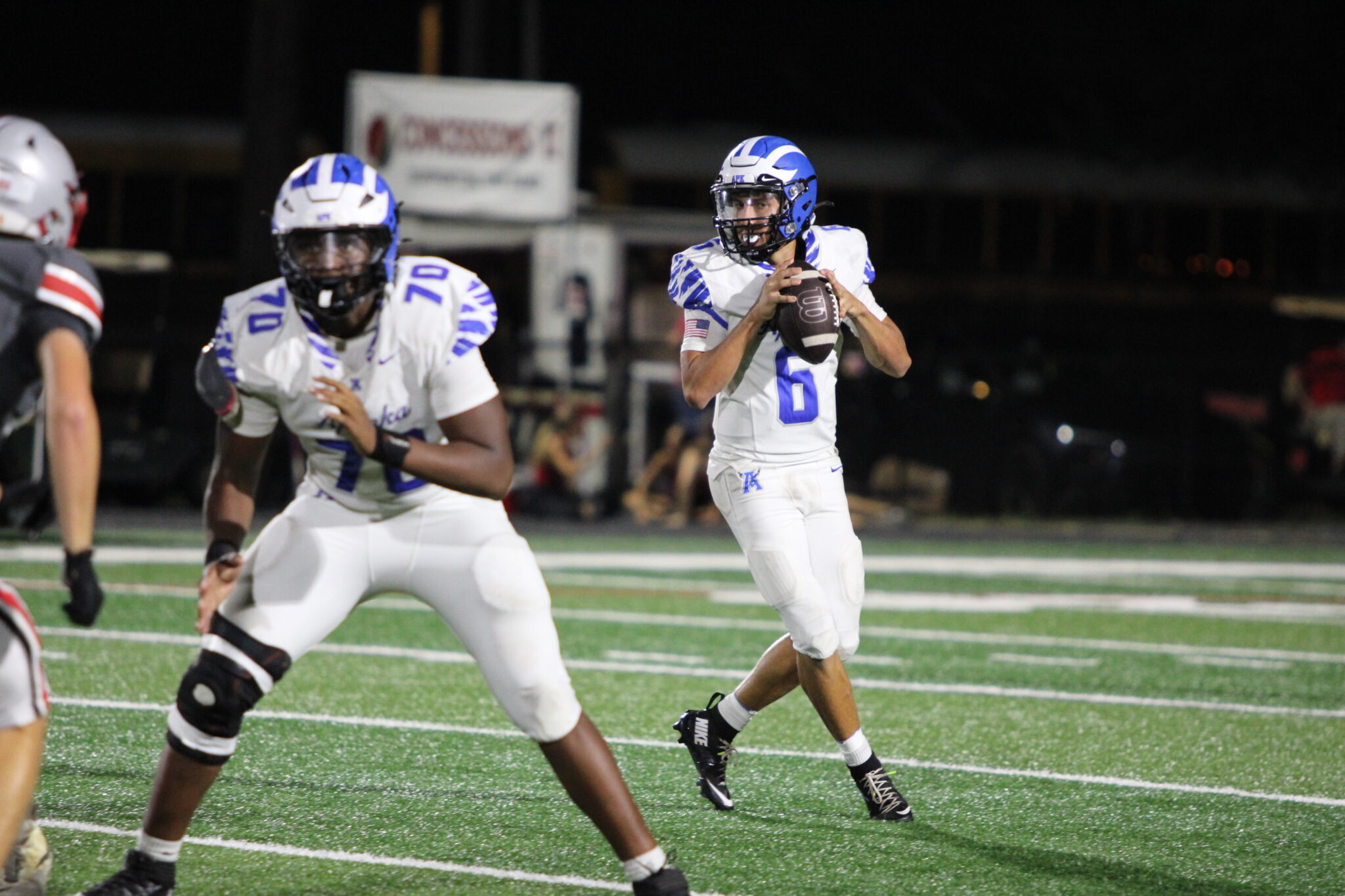 Kai Goodling drops back and looks left to pass.
