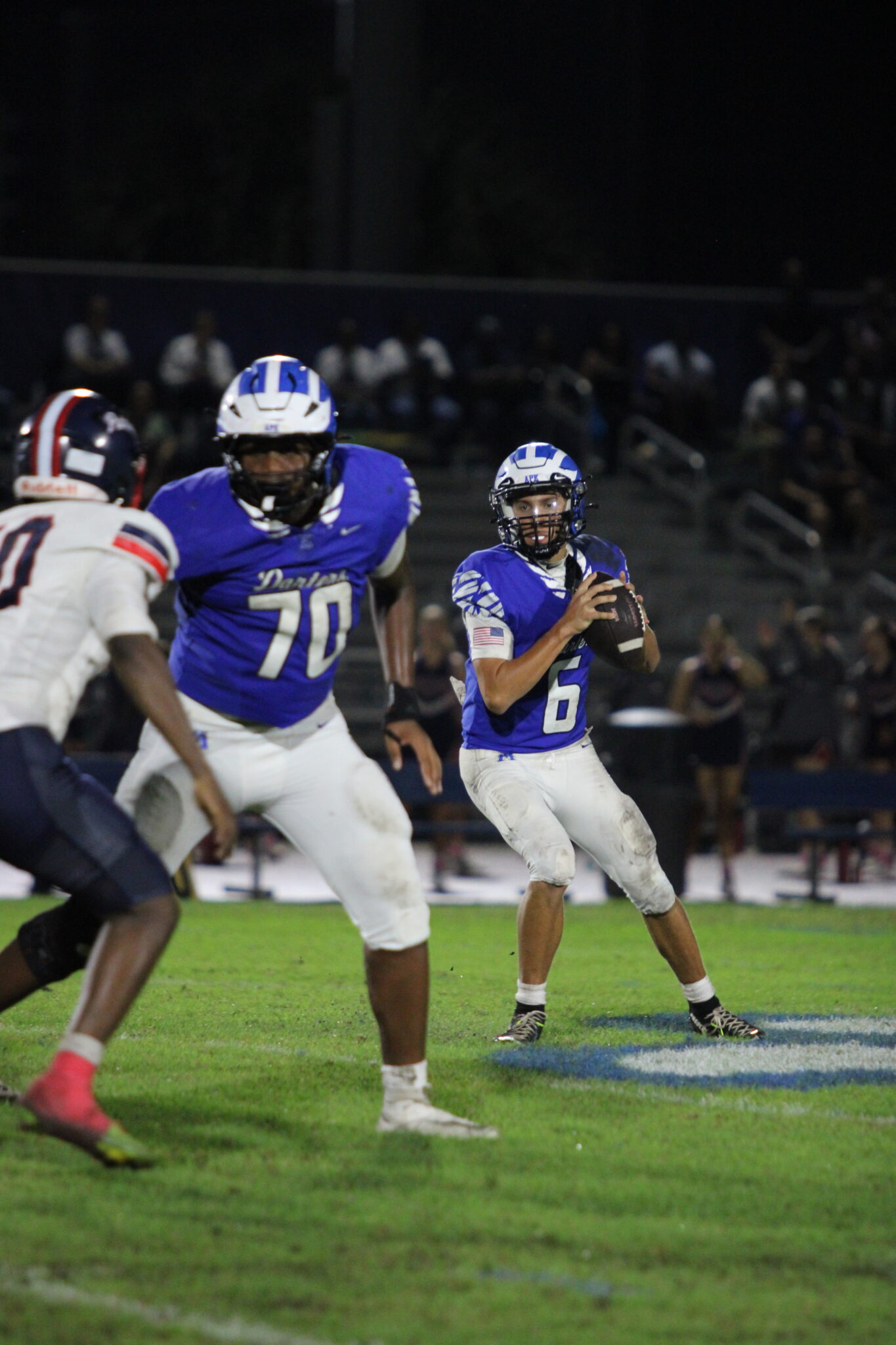 Kai Goodling looks for a pass behind his blocker Wilgains Vaval.