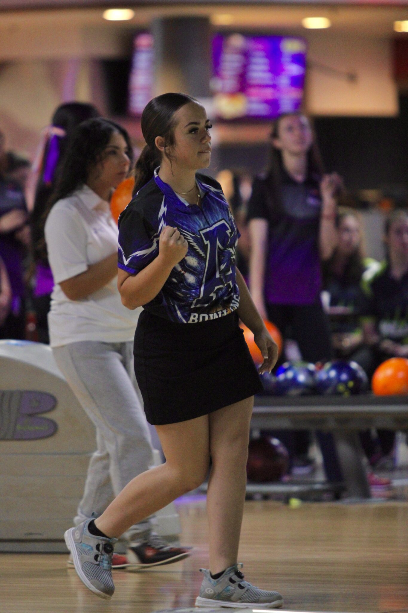 Madelynn Scofield pumps her fist after a spare.