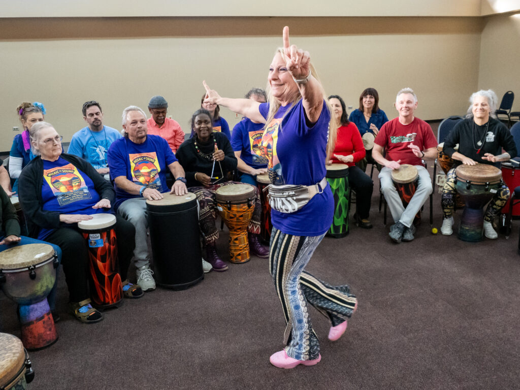Marla Singleton stands in the center of a Village Music Circle in New Mexico.