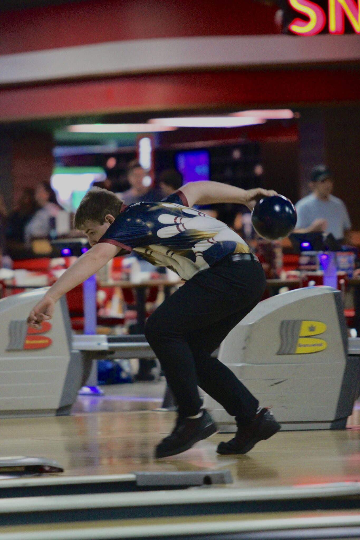 Nathan Karcher torques his body to whip in a shot.