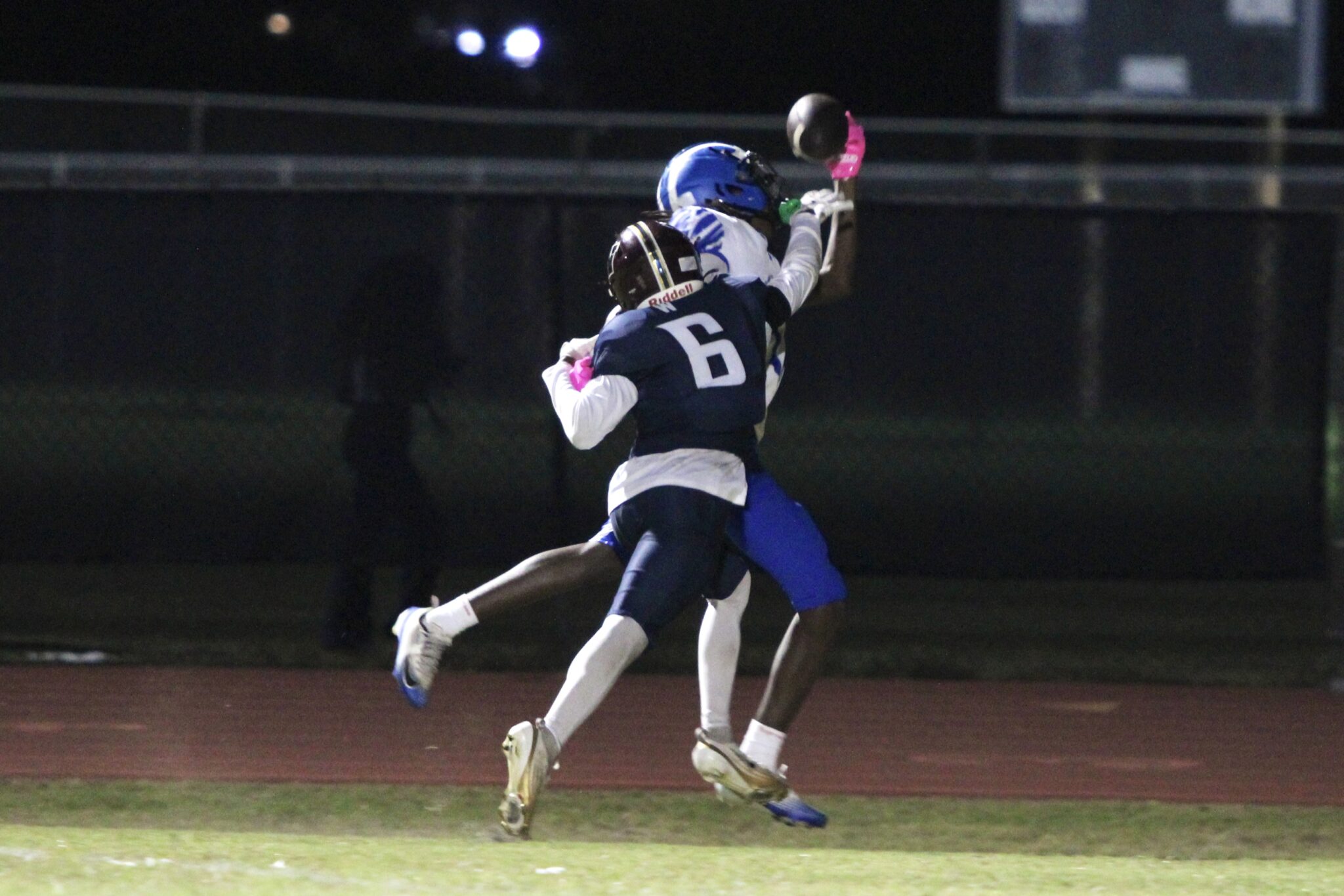 Nyzier Collington makes a spectacular one-handed catch over Mustang defender Tommy Henderson with perfect coverage.