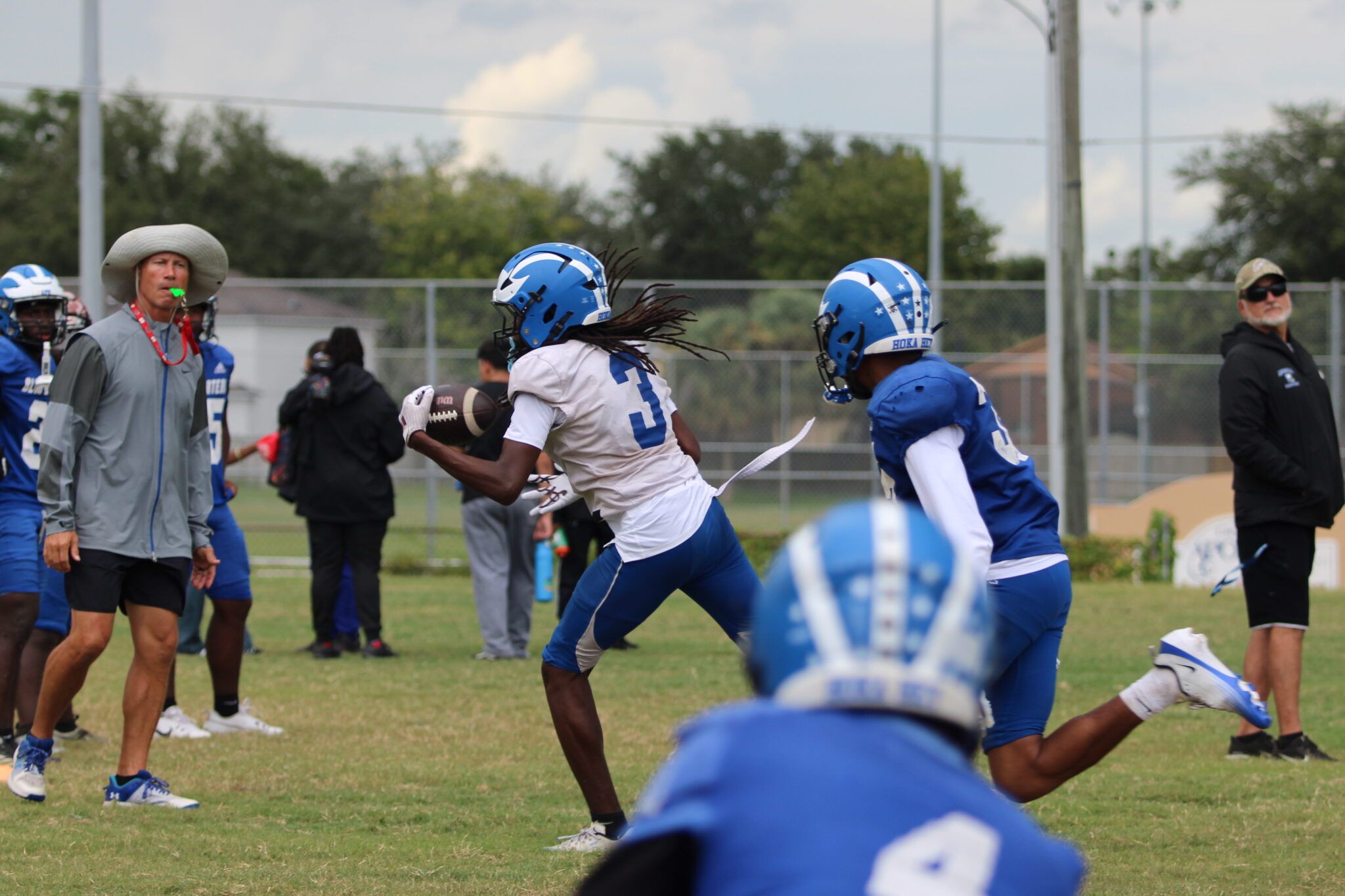 Nyzier Collington makes one handed grab on the sideline in practice.