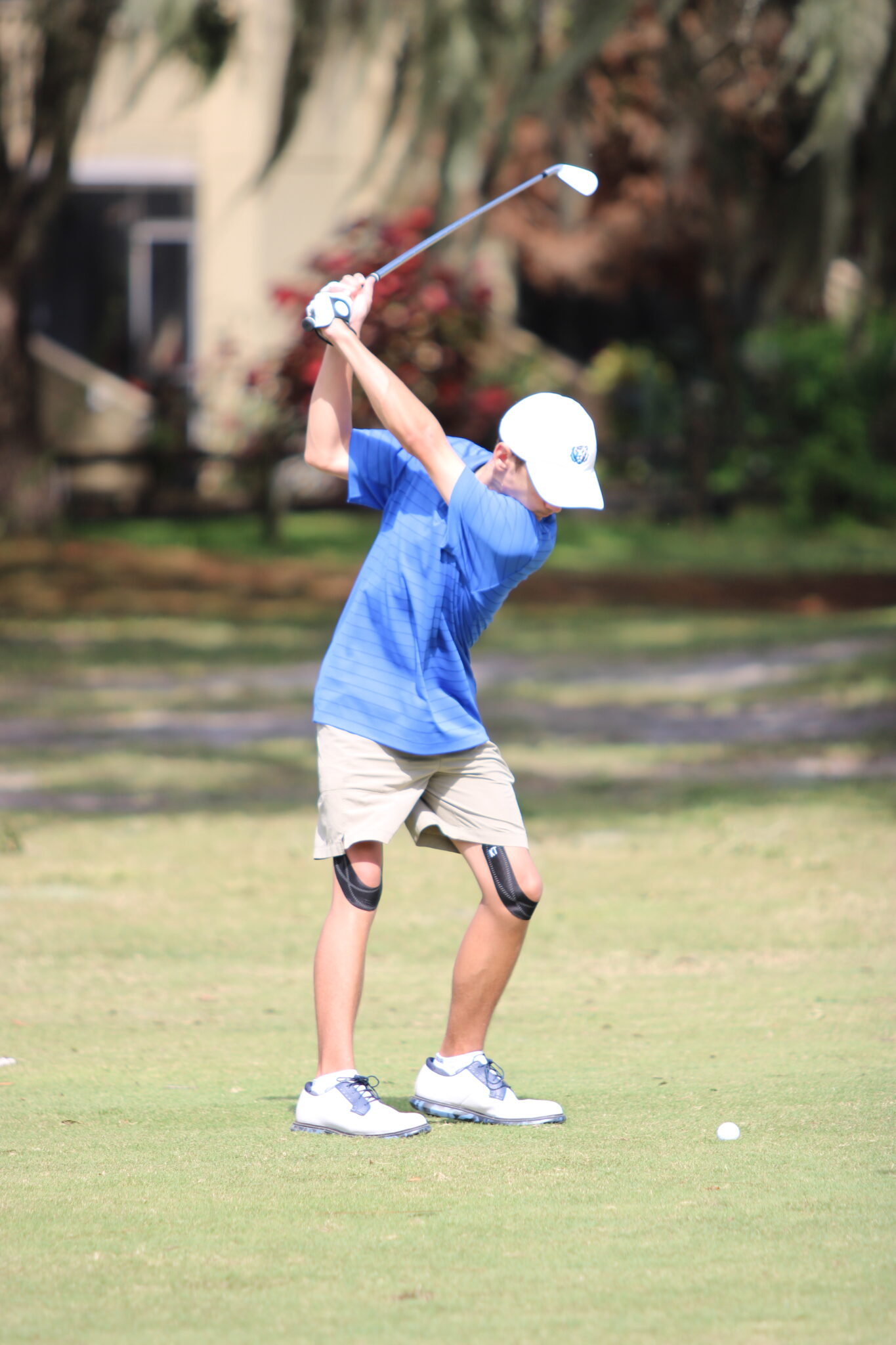 Owen Ancona winds back his iron to send a ball on to the green.