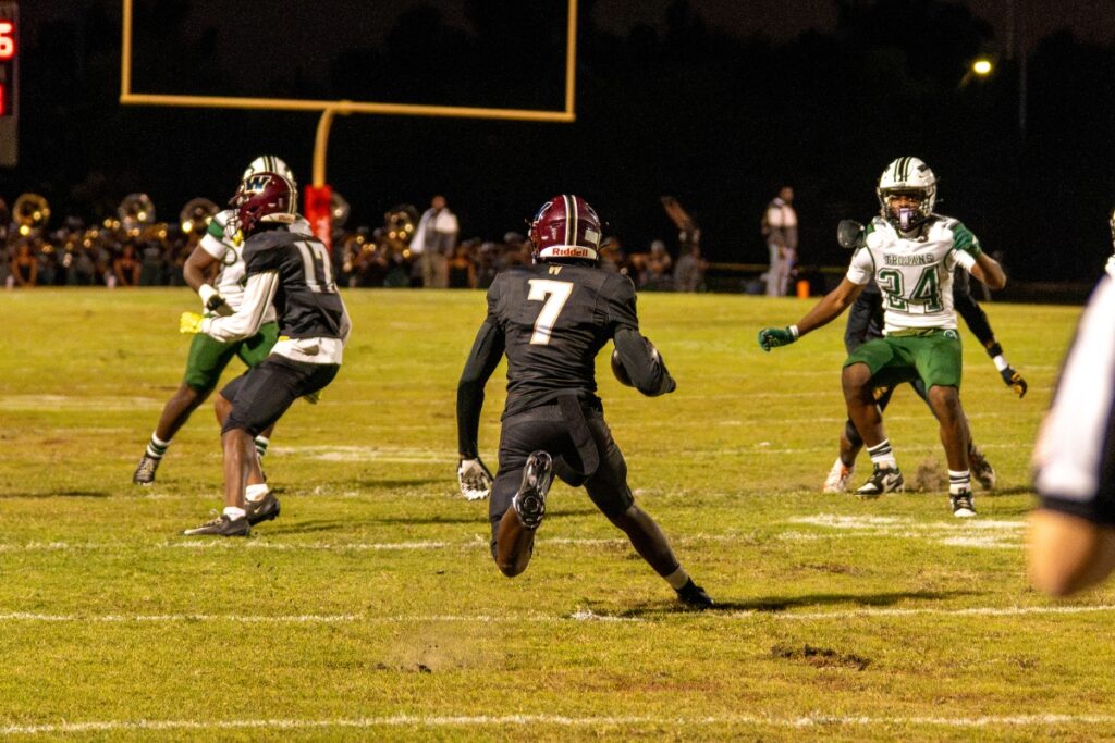 Reshard Ricketts looks for running room in the first quarter of Wekiva's game against Evans Friday night at Mustang Field.