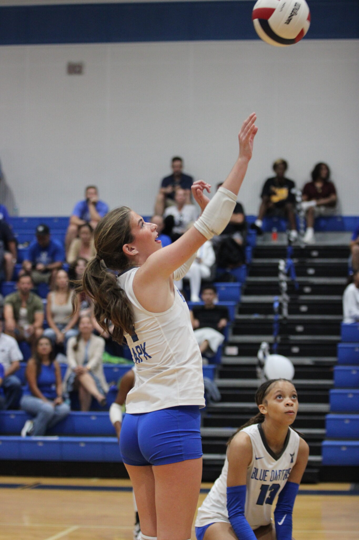 Taylor Cain tips a ball on the right side of the net in set three.