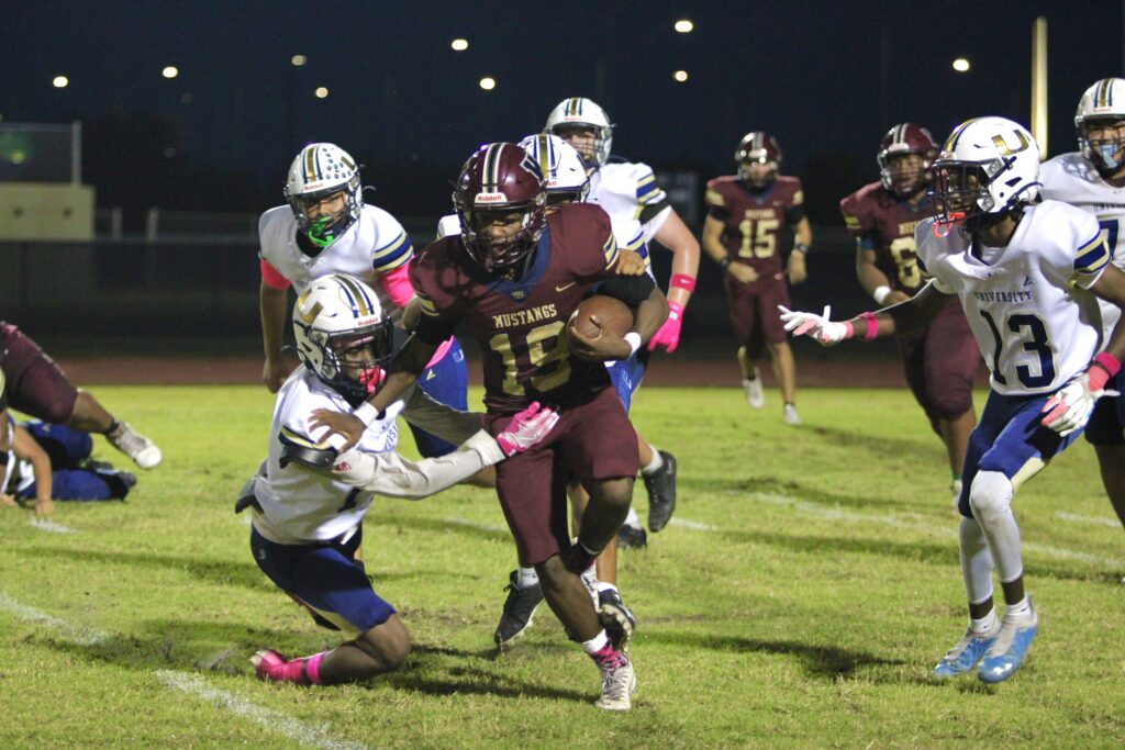 Tre'veion Goldsmith takes a carry outside and shrugs off a tackle.