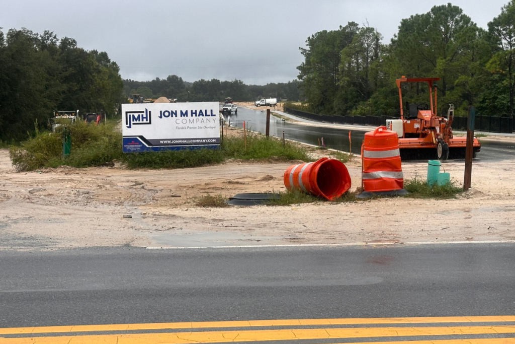 A Jon M. Hall Company sign and construction equipment stand at the Chandler Row site in Apopka on Oct. 7. City officials say vibration complaints from nearby Oak Ridge residents prompted repeated interventions during construction.